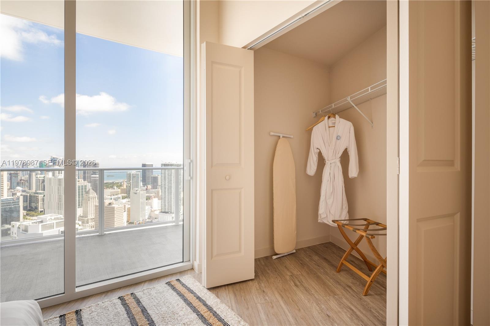 275 Southwest 6th Street, Unit 2007 Miami, FL 33130 - Photo 9 of 24 a view of walk in closet with clothes and shoes