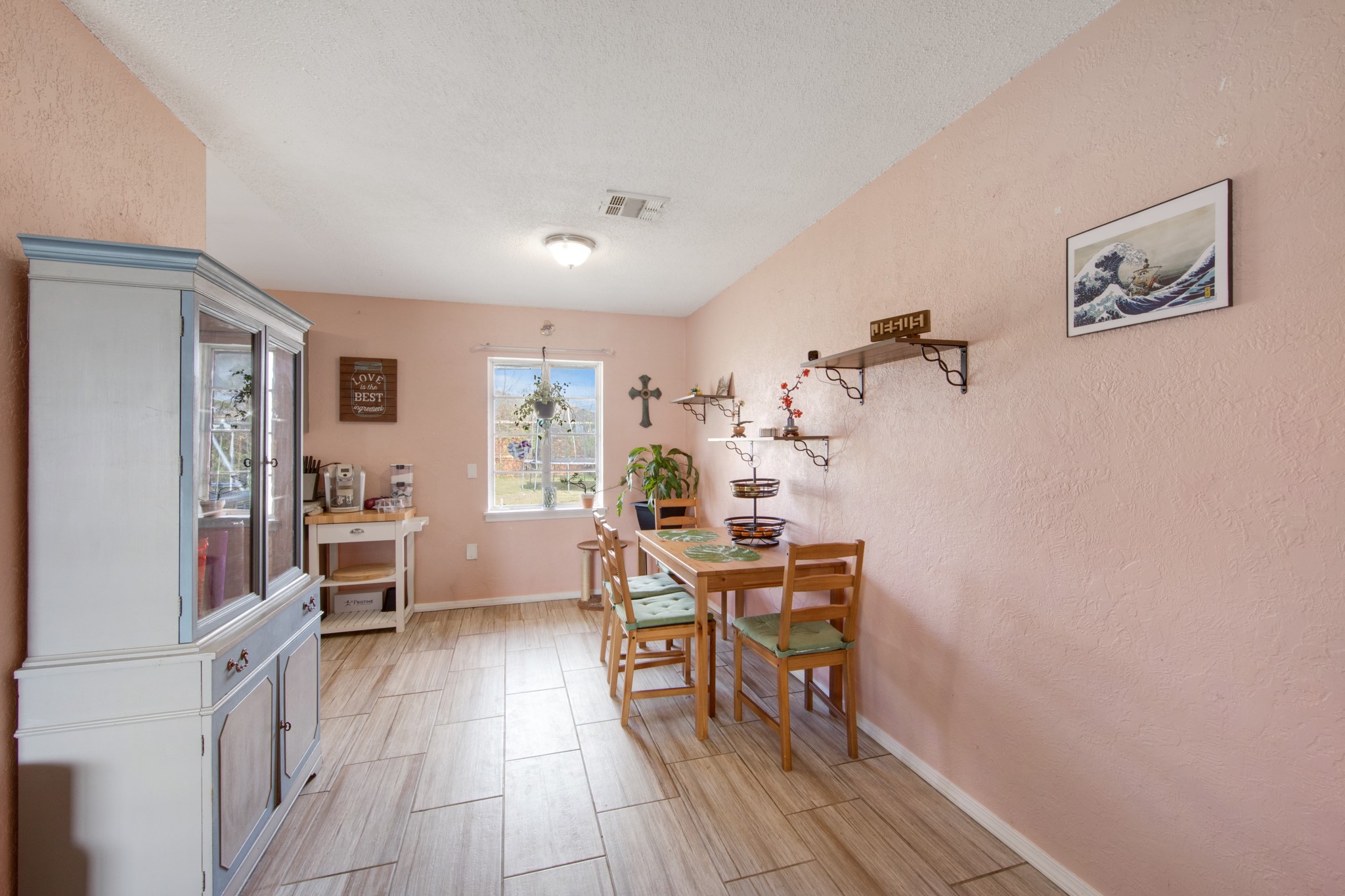 8901 Woodlyn Road Houston, TX 77078 - Photo 9 of 22 a view of a workspace with furniture and wooden floor