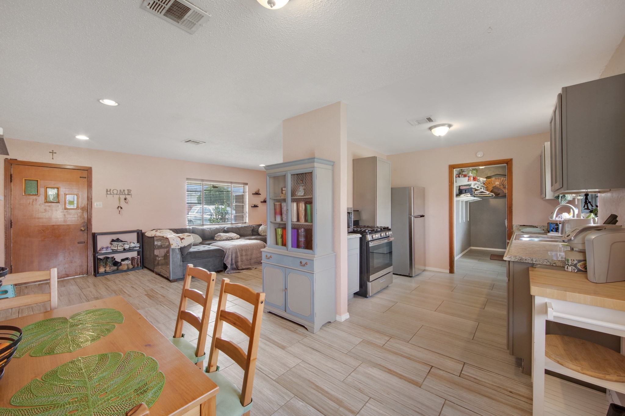 8901 Woodlyn Road Houston, TX 77078 - Photo 10 of 22 a living room with furniture and a wooden floor