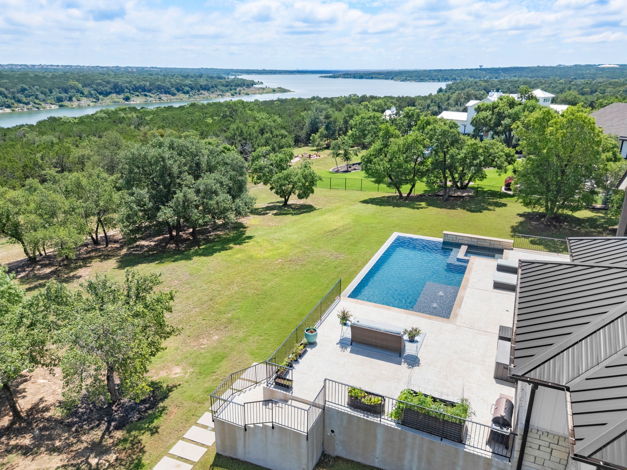 1021 Lower Peninsula Loop Georgetown, TX 78633 - Photo 1 of 1 Outdoor pool with integrated spa and sun shelf