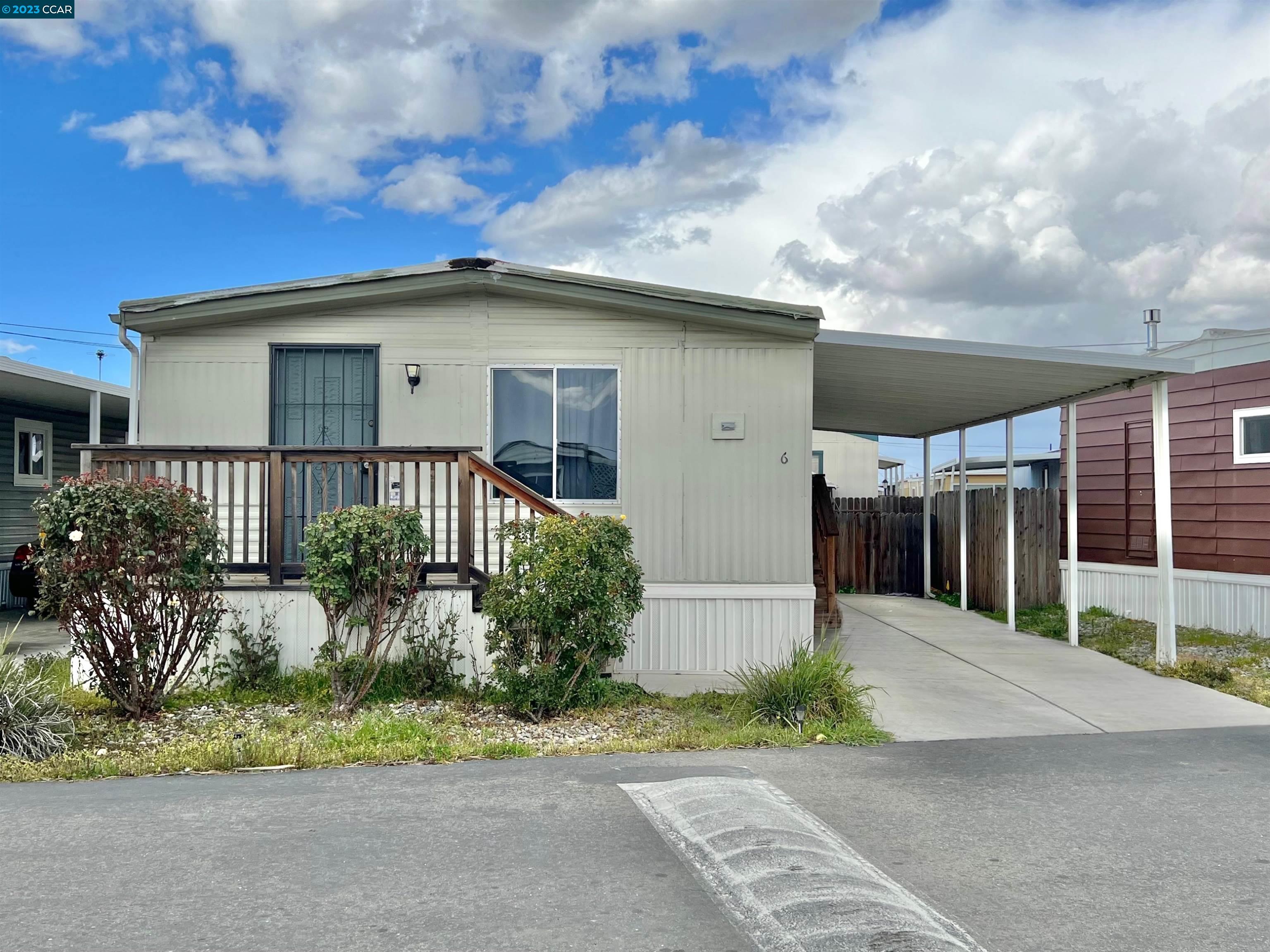 8200 Jantzen Road, Unit 6 Modesto, CA 95357 - Photo 1 of 1 a front view of a house with a yard