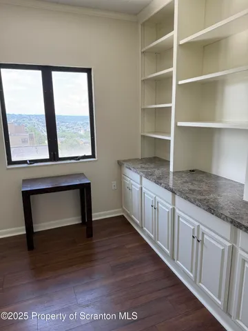 a hallway with sink and a window