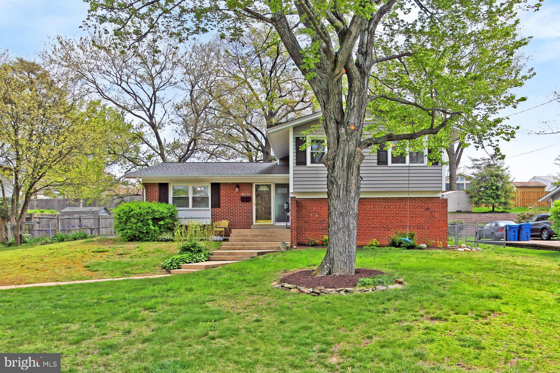 6011 Meriwether Lane Springfield, VA 22150 - Photo 2 of 53 a front view of house with yard