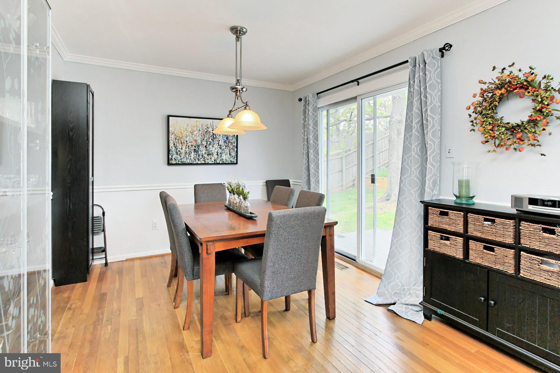 6011 Meriwether Lane Springfield, VA 22150 - Photo 11 of 53 a view of a dining room with furniture window and wooden floor