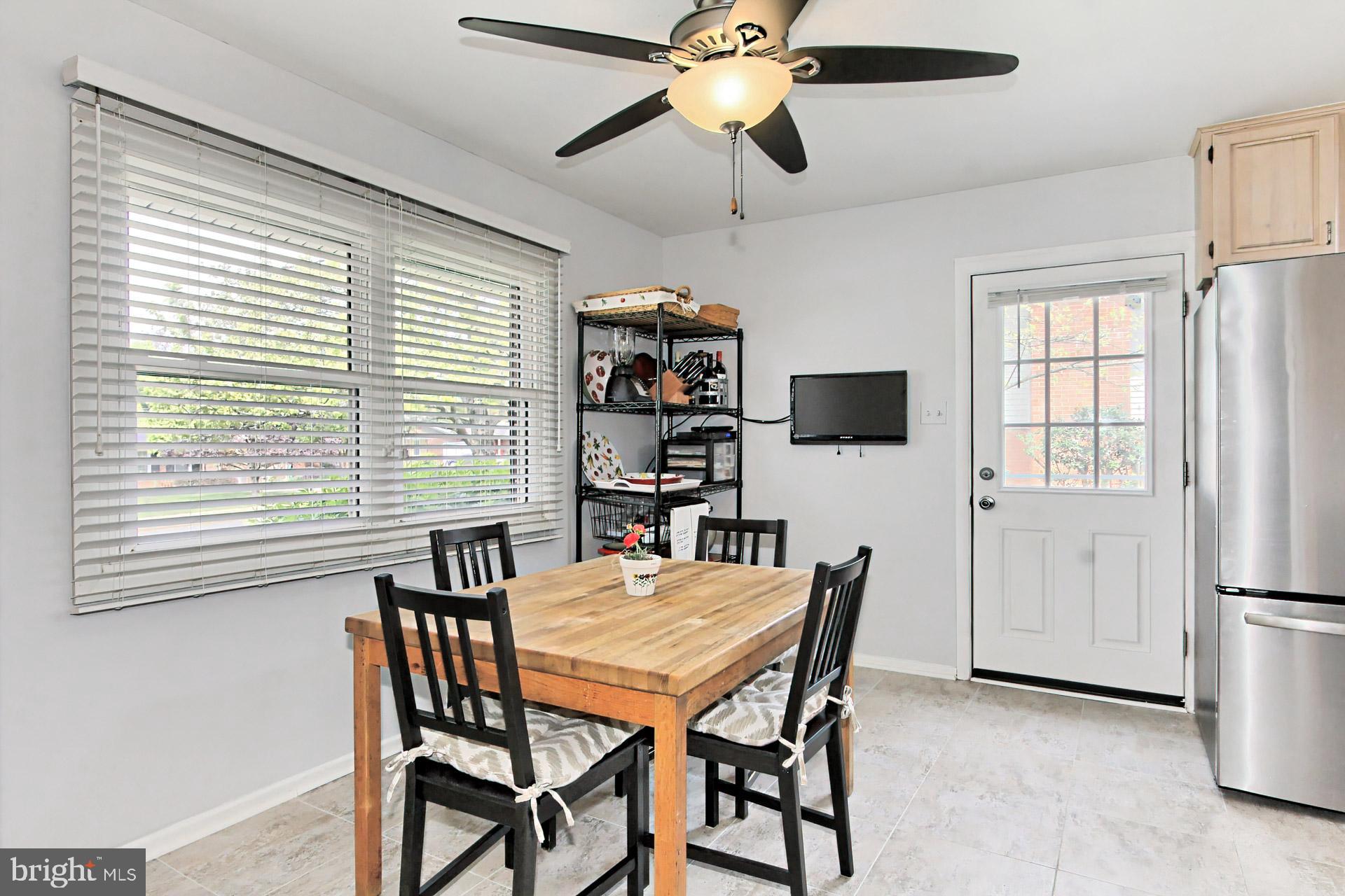 6011 Meriwether Lane Springfield, VA 22150 - Photo 18 of 53 a view of a dining room with furniture and a window