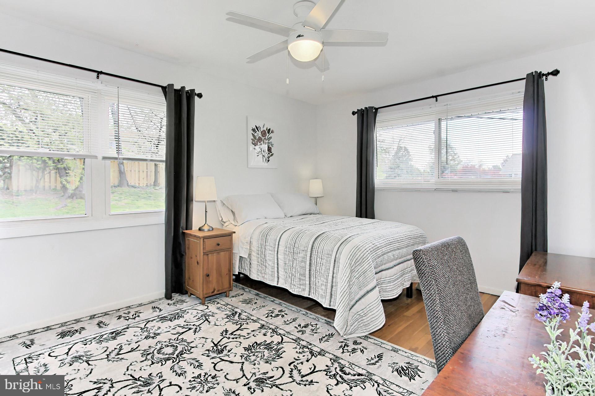 6011 Meriwether Lane Springfield, VA 22150 - Photo 19 of 53 a bedroom with a large bed and a window