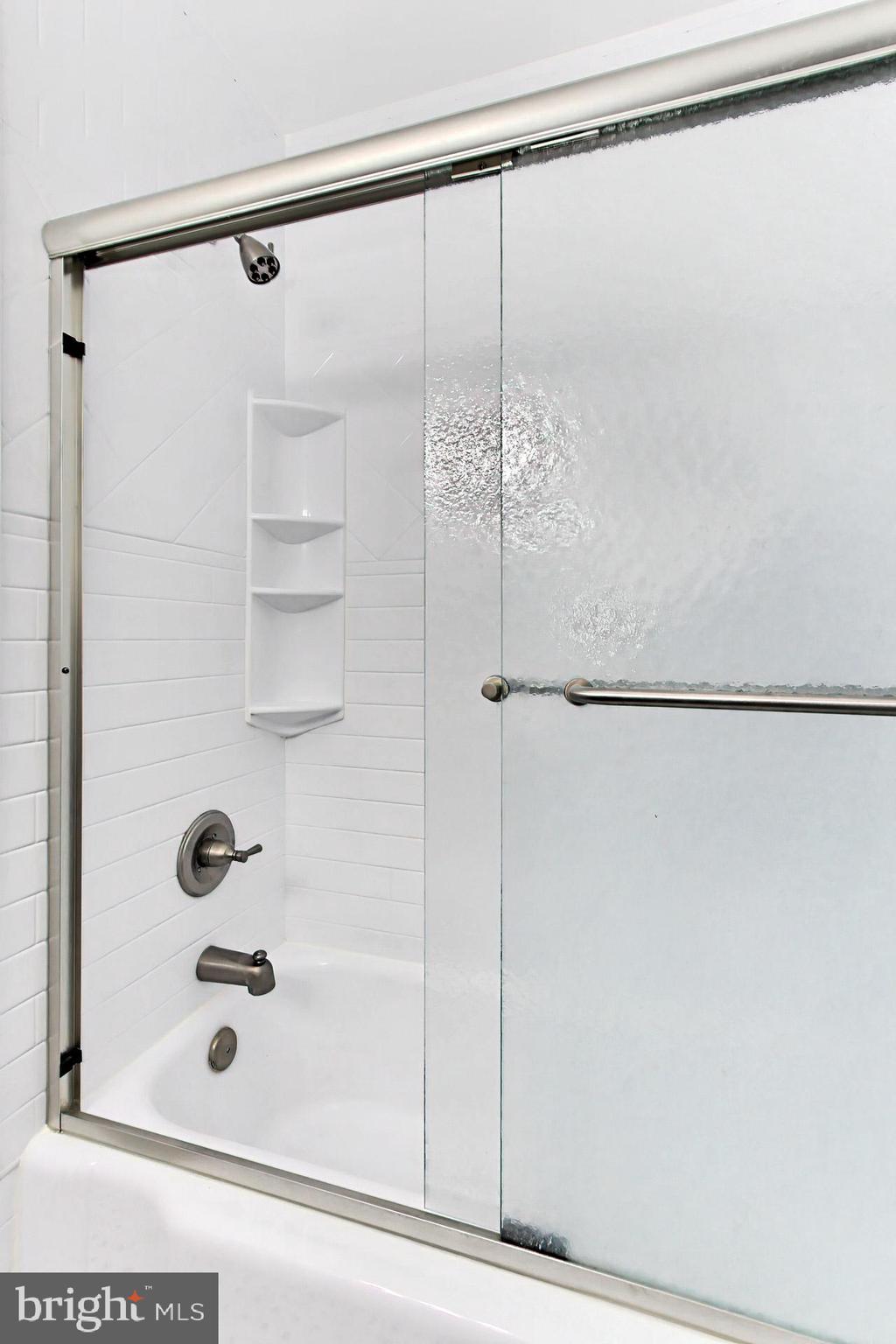 6011 Meriwether Lane Springfield, VA 22150 - Photo 26 of 53 a bathroom with a glass shower door