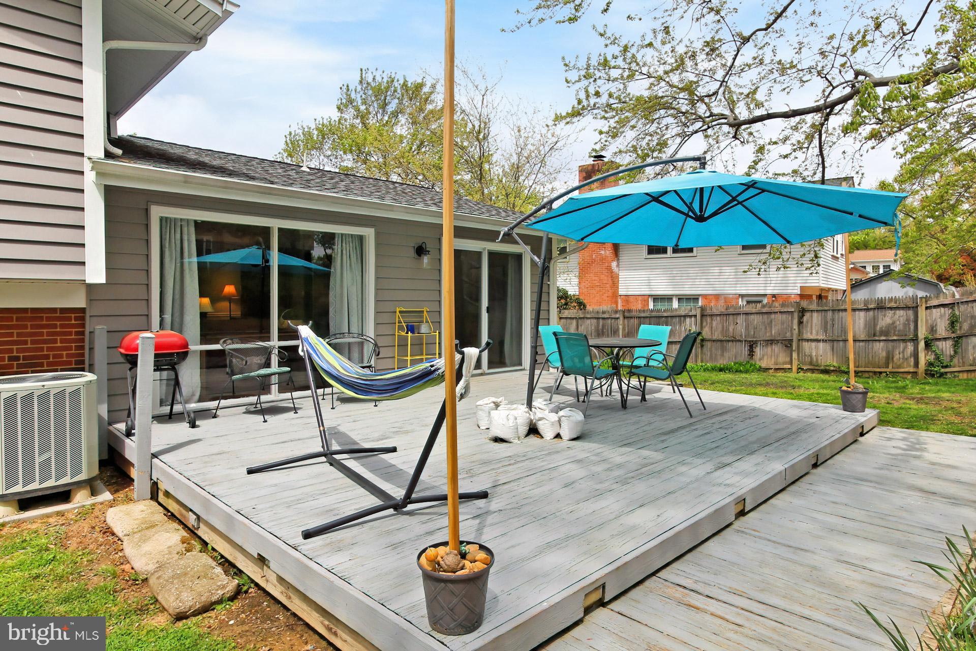 6011 Meriwether Lane Springfield, VA 22150 - Photo 37 of 53 a view of a backyard with a sitting area and furniture