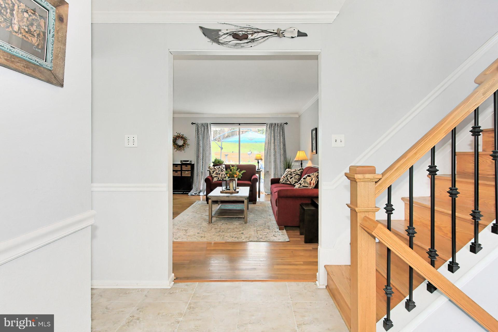 6011 Meriwether Lane Springfield, VA 22150 - Photo 5 of 53 a living room with furniture and stairs