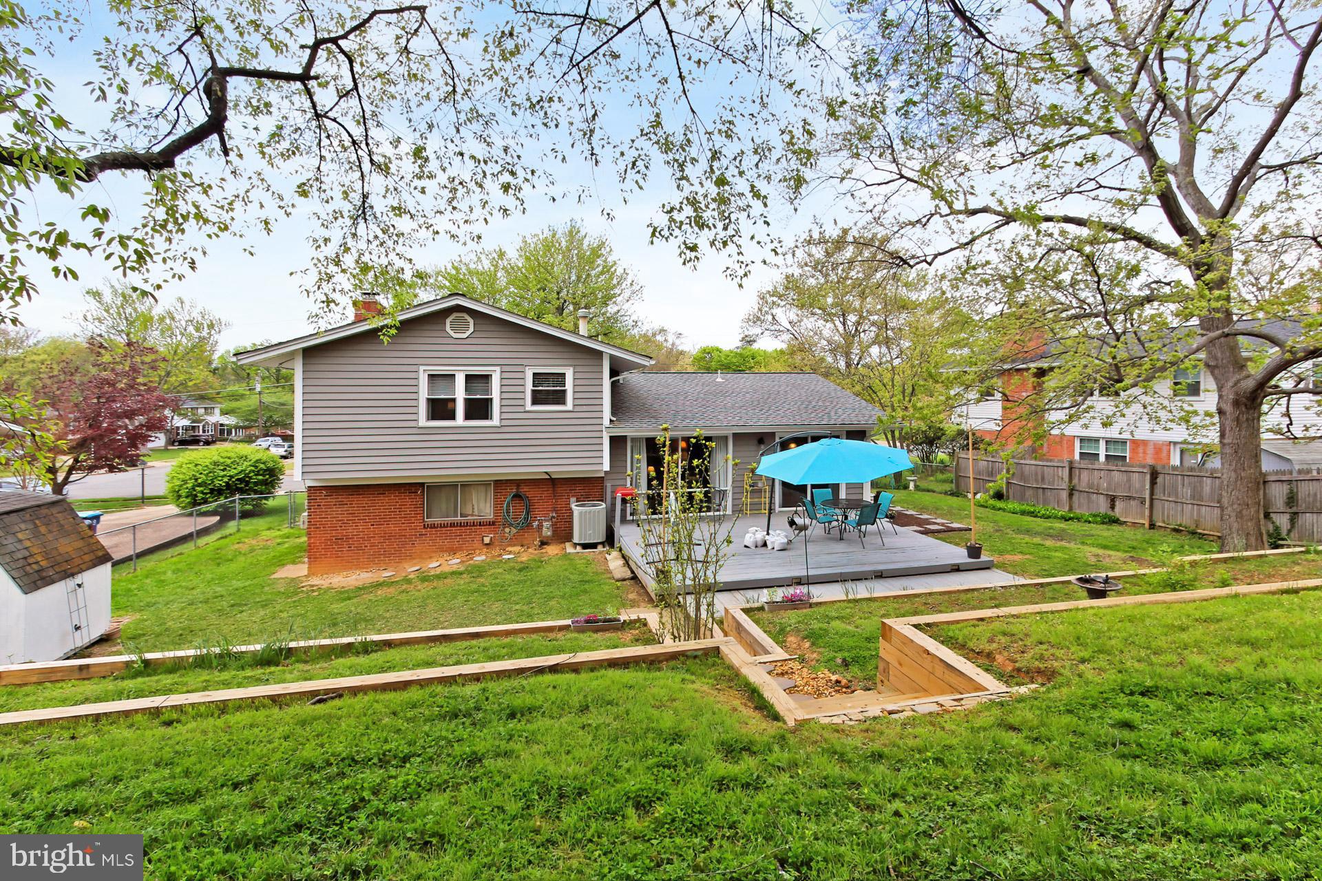 6011 Meriwether Lane Springfield, VA 22150 - Photo 44 of 53 front view of a house with a yard