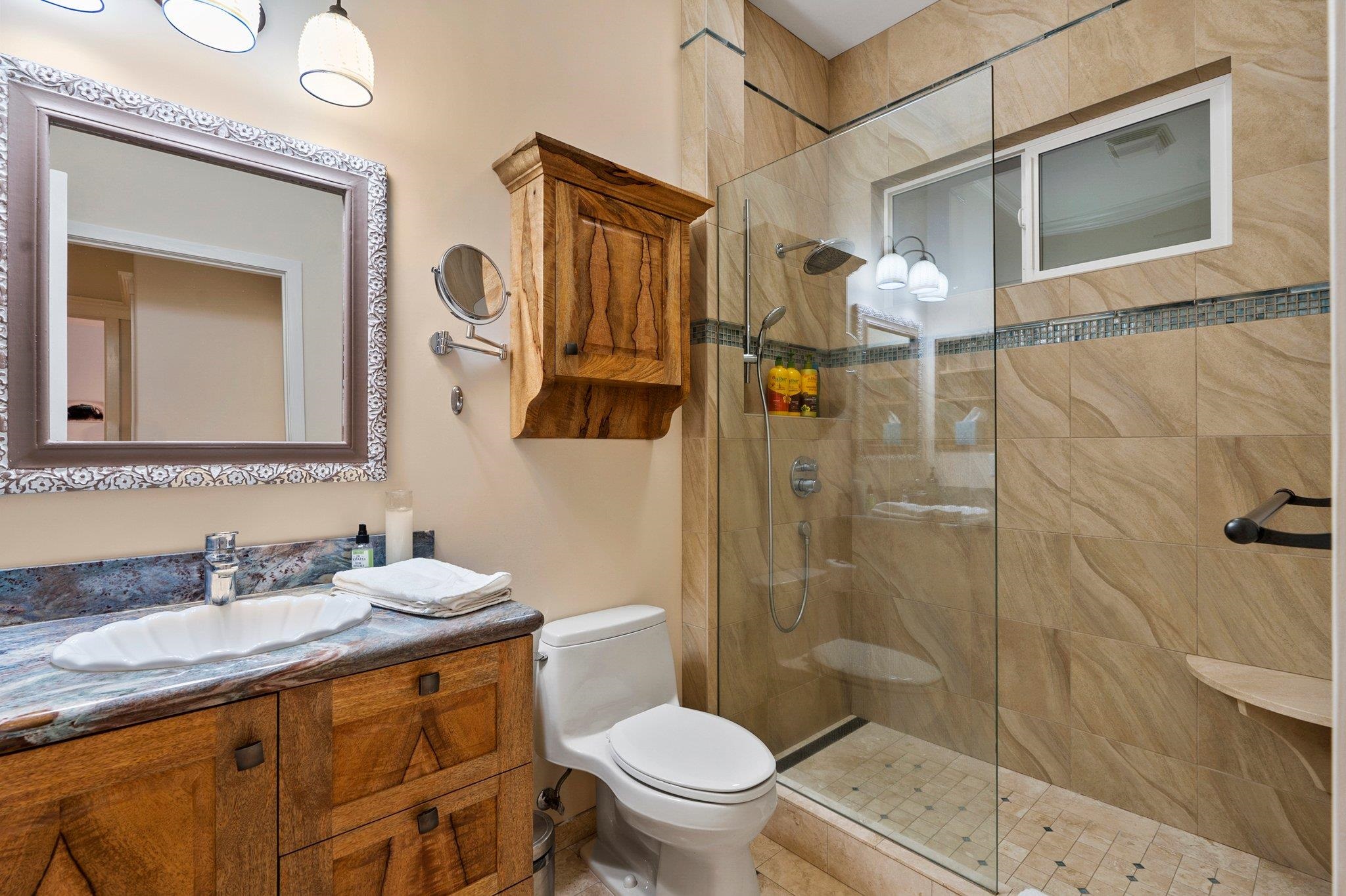 370 Waiama Way Haiku, HI 96708 - Photo 12 of 24 a bathroom with a granite countertop sink toilet and shower