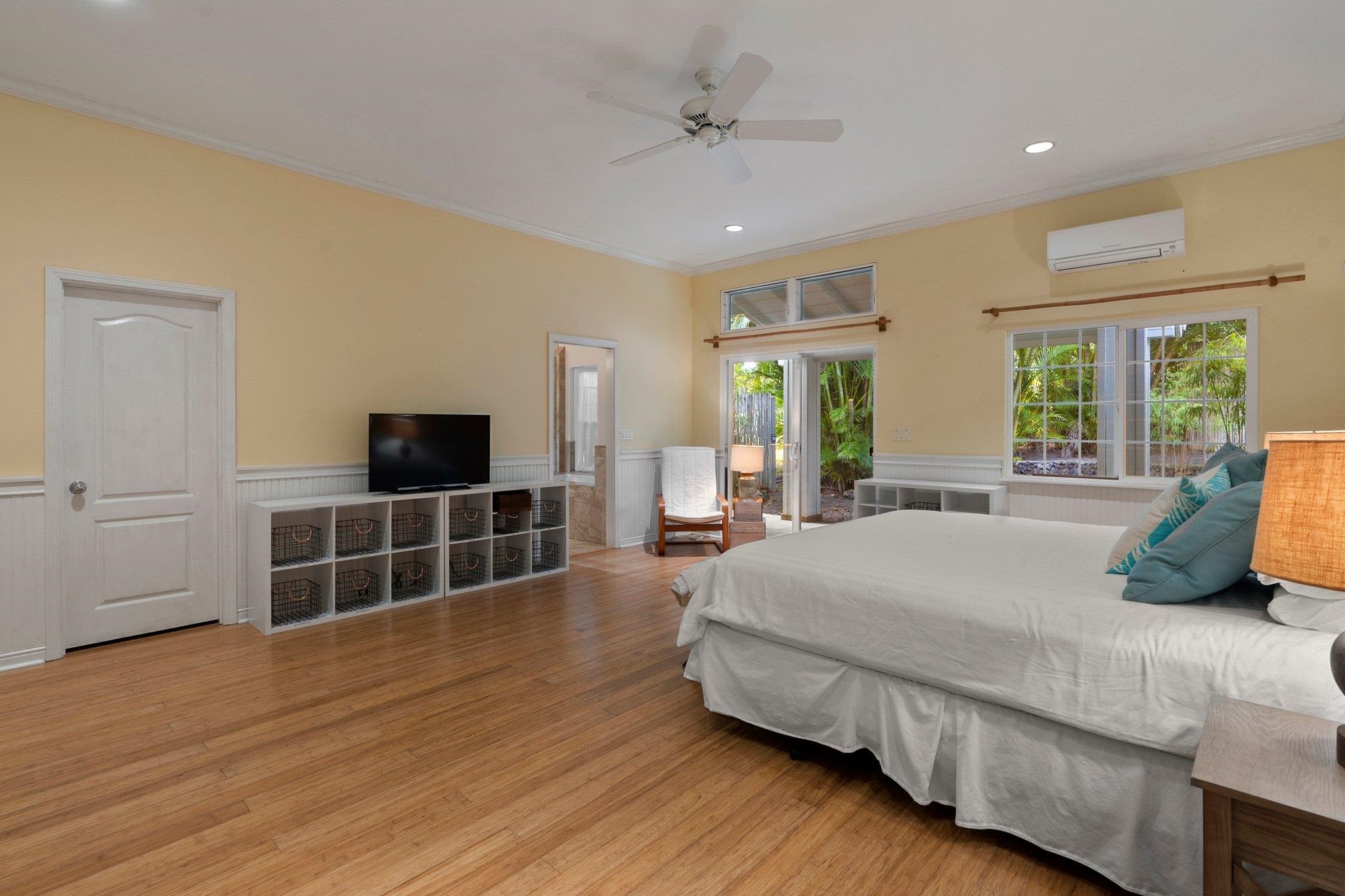 370 Waiama Way Haiku, HI 96708 - Photo 15 of 24 a bedroom with a bed and flat screen tv