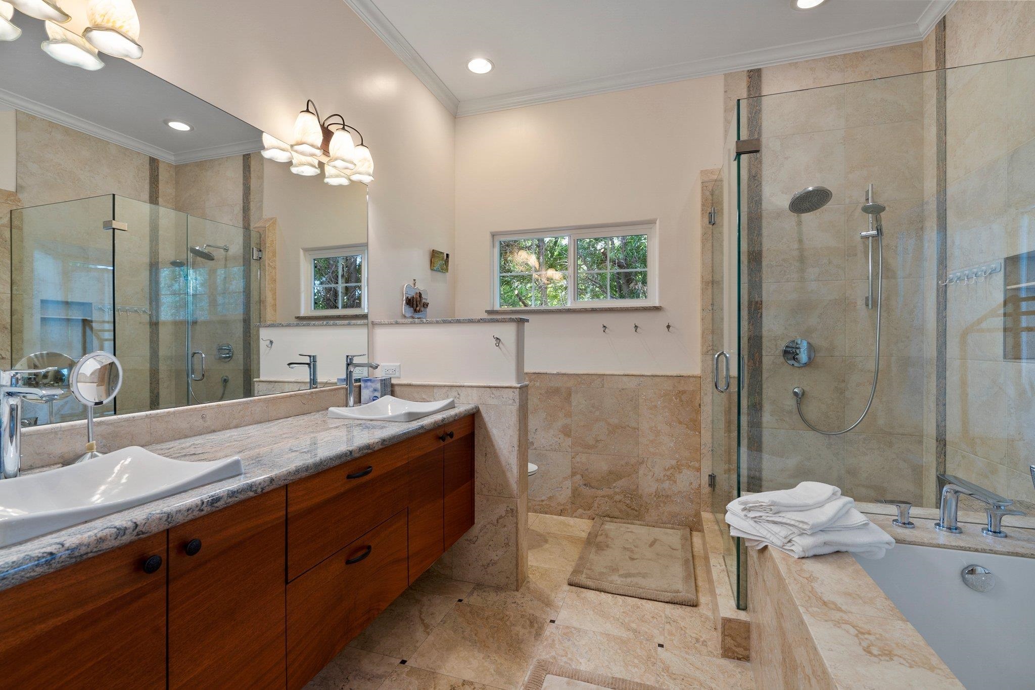 370 Waiama Way Haiku, HI 96708 - Photo 16 of 24 a spacious bathroom with a granite countertop sink mirror and shower