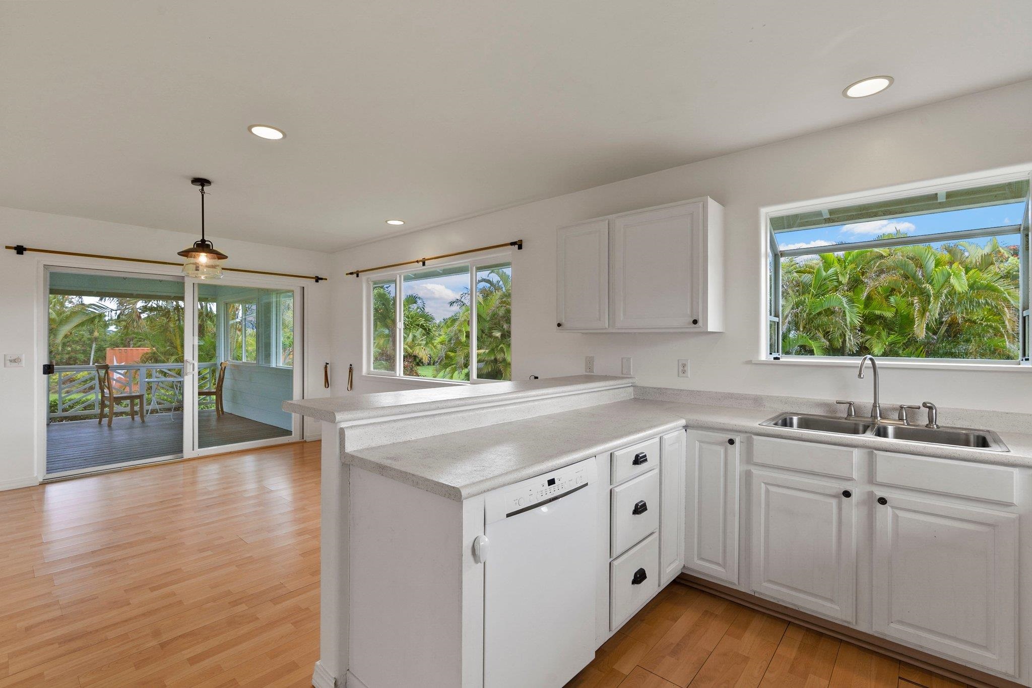 370 Waiama Way Haiku, HI 96708 - Photo 22 of 24 a kitchen with a sink stove and cabinets