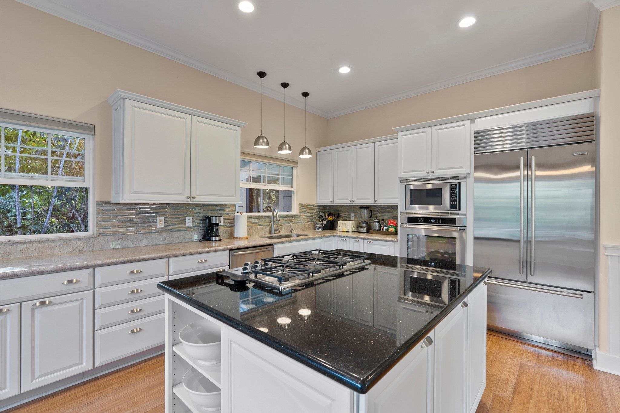 370 Waiama Way Haiku, HI 96708 - Photo 4 of 24 a kitchen with stainless steel appliances granite countertop a sink stove and refrigerator