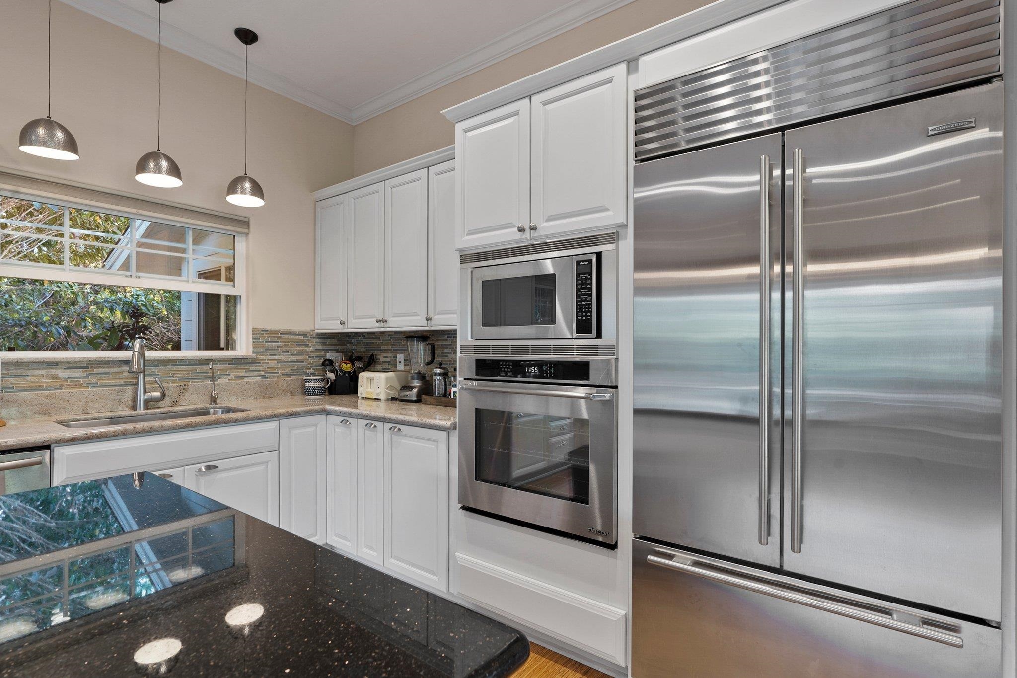370 Waiama Way Haiku, HI 96708 - Photo 5 of 24 a kitchen with a sink stainless steel appliances and cabinets