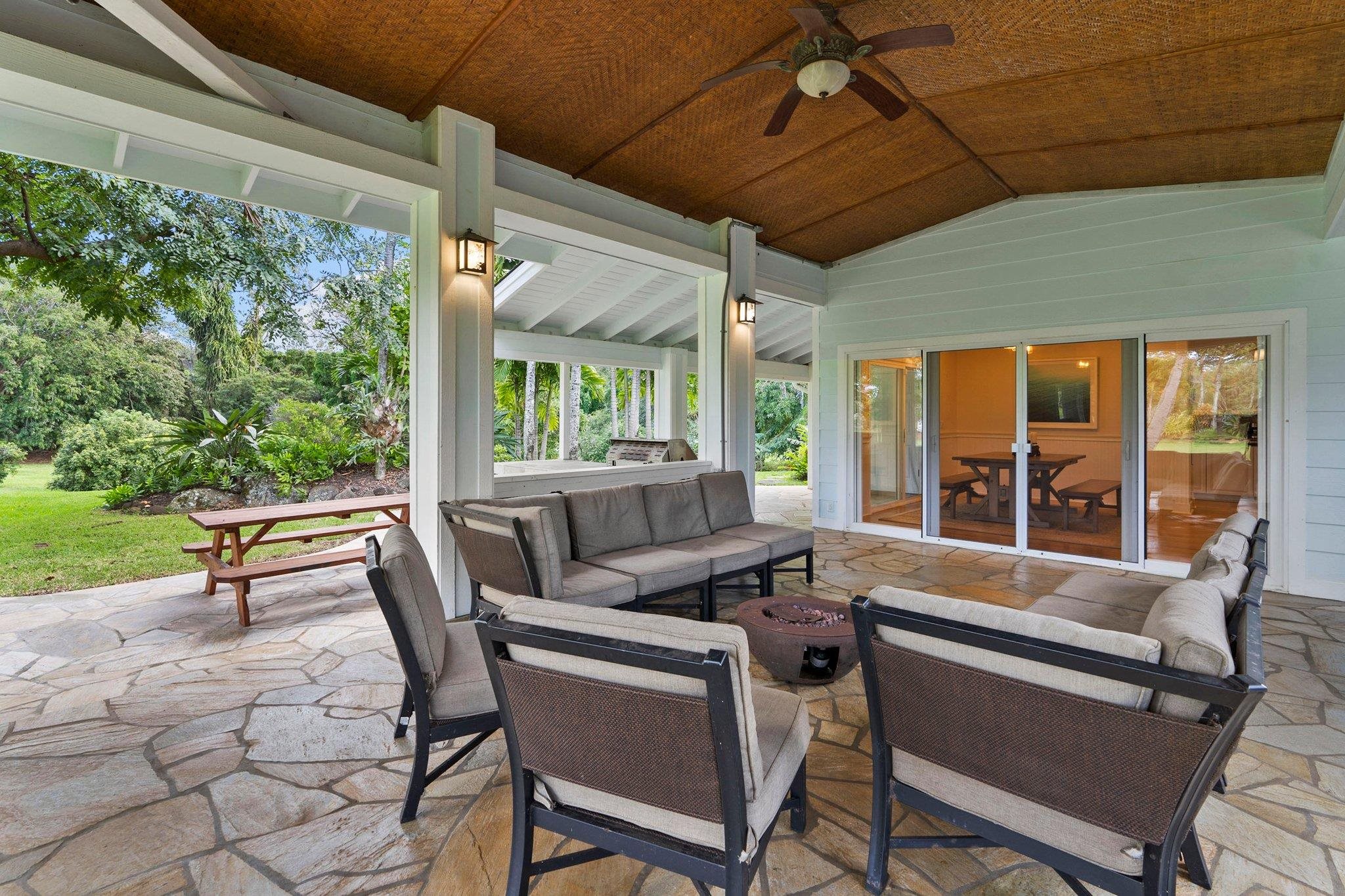 370 Waiama Way Haiku, HI 96708 - Photo 8 of 24 a dining room with a wooden table and chairs