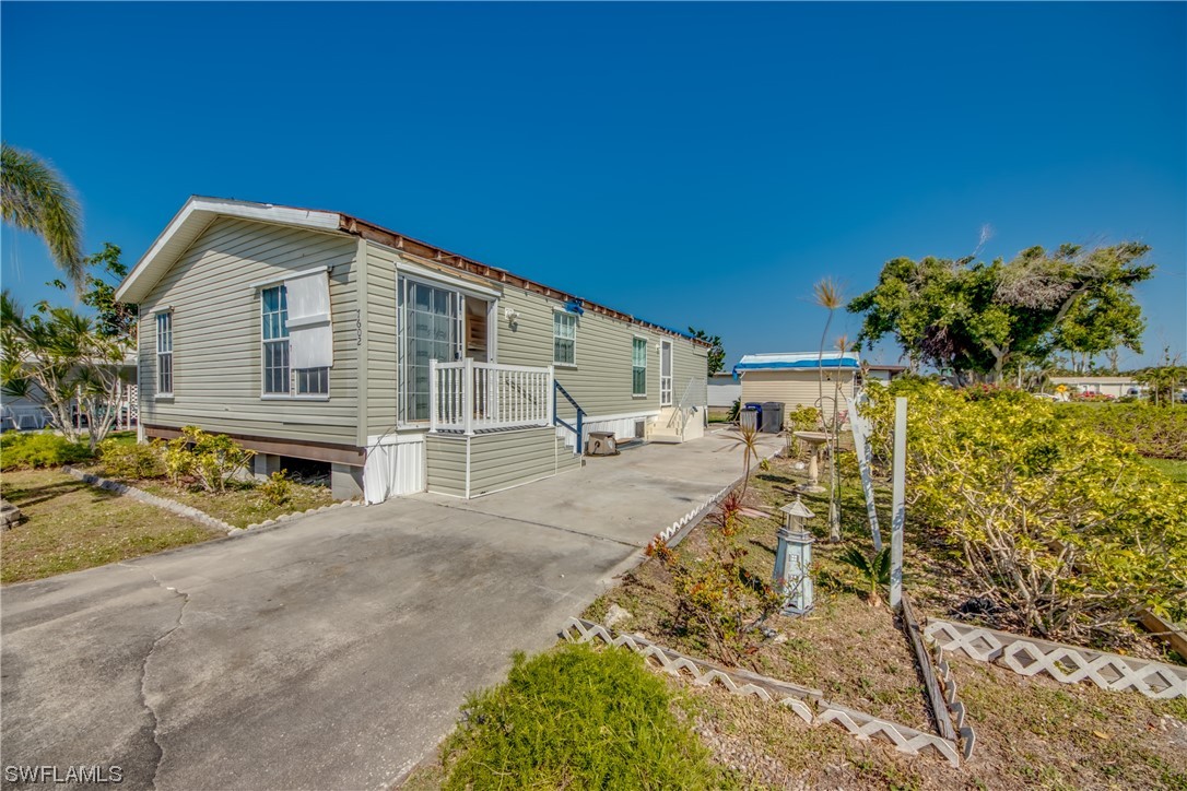 7602 Helen Road Bokeelia, FL 33922 - Photo 3 of 35 a view of a house with backyard