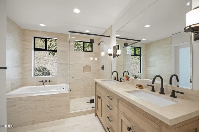 a bathroom with a double vanity sink mirror and double