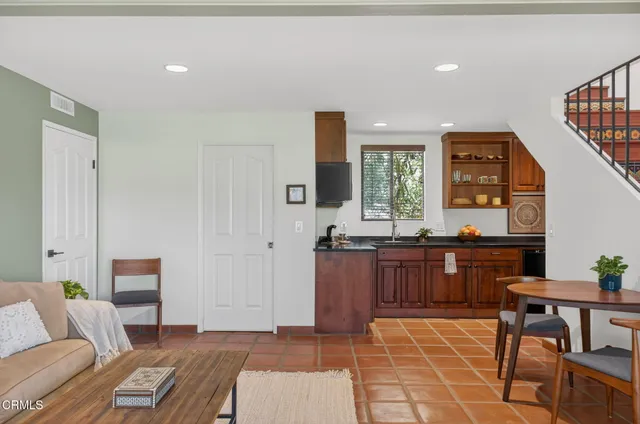 a bedroom with a large bed and a large window