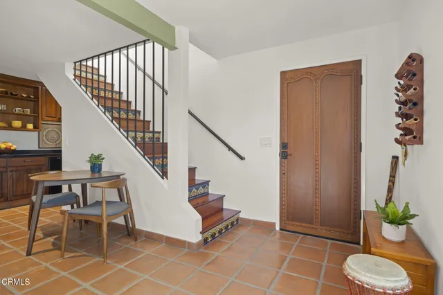 a bedroom with bed and wooden floor