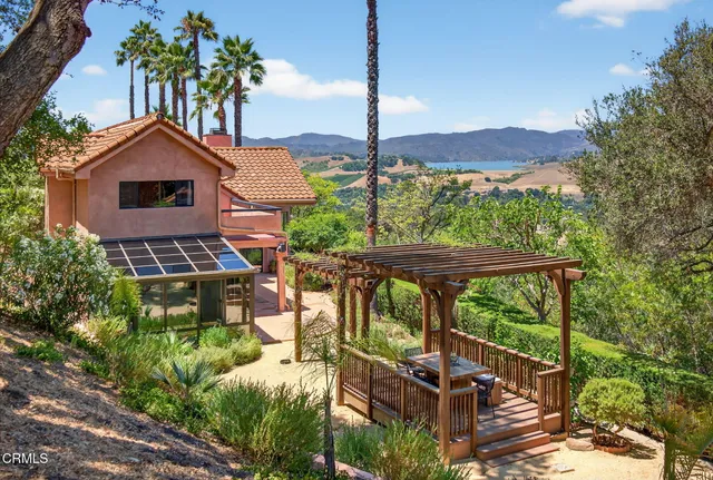 a view of a chairs and table in the patio