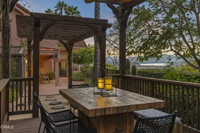 a view of a patio with a table and chairs