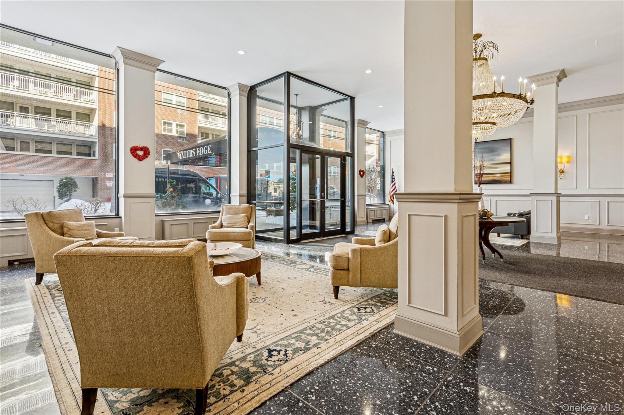 700 Shore Road, Unit 5U Long Beach, NY 11561 - Photo 3 of 21 a living room with furniture a large window and kitchen view