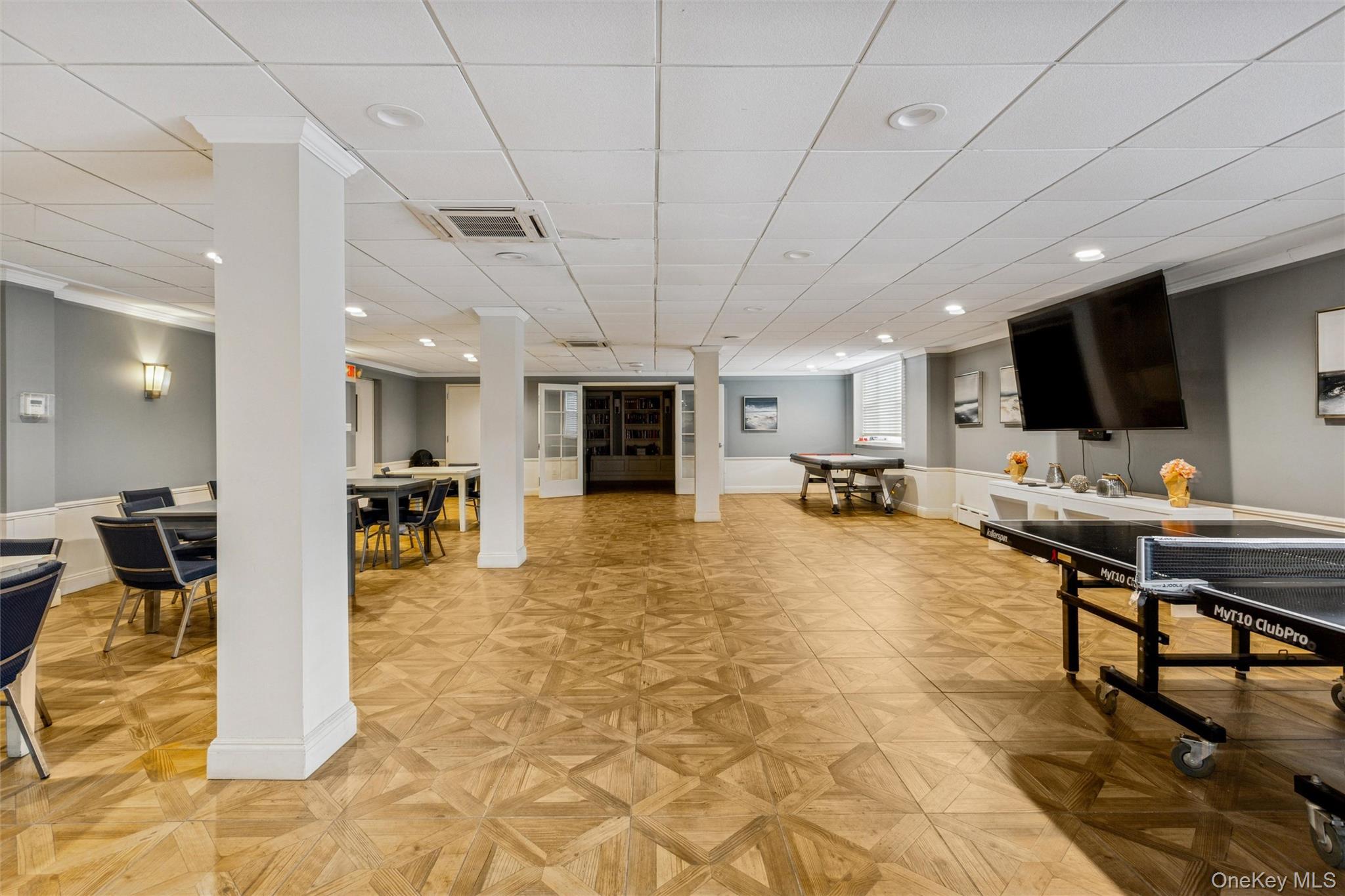700 Shore Road, Unit 5U Long Beach, NY 11561 - Photo 6 of 21 a lobby with furniture and a flat screen tv