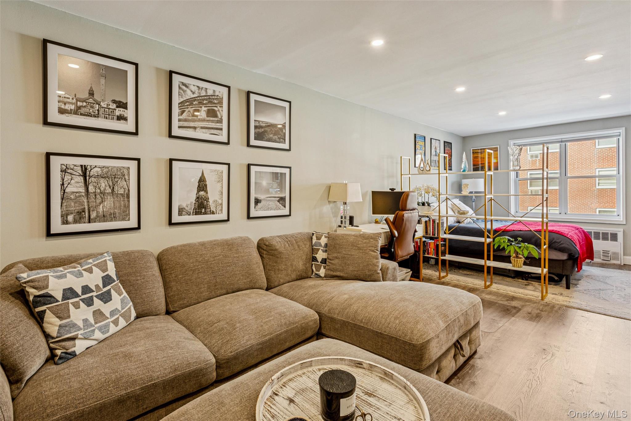 700 Shore Road, Unit 5U Long Beach, NY 11561 - Photo 8 of 21 a living room with furniture a couch and a large window