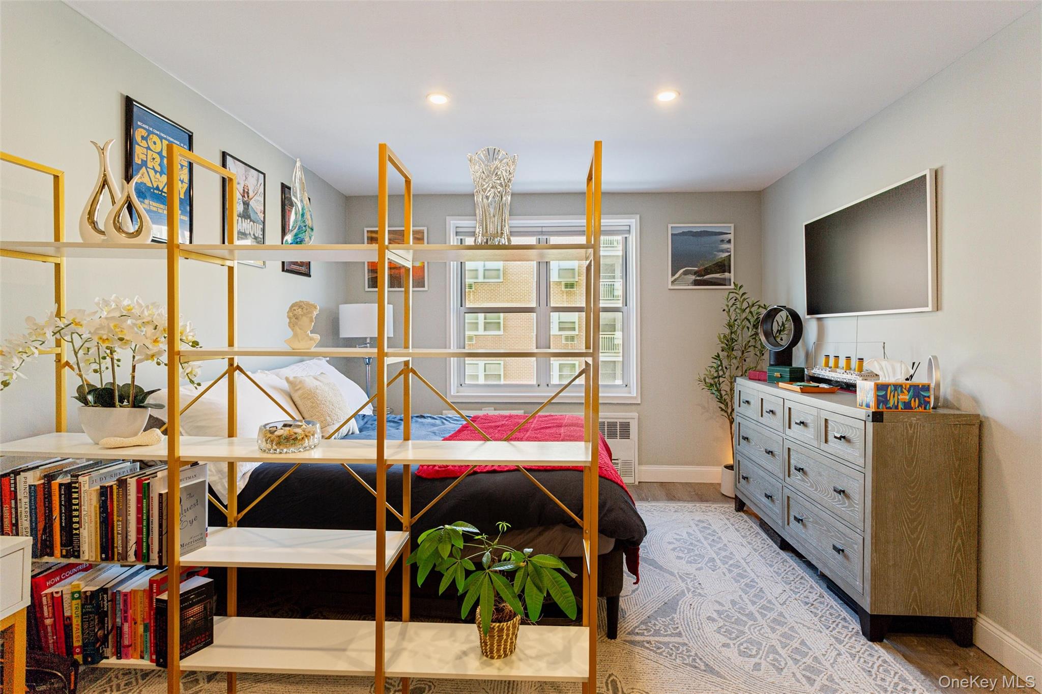 700 Shore Road, Unit 5U Long Beach, NY 11561 - Photo 10 of 21 a bedroom with furniture a bed and a flat tv screen