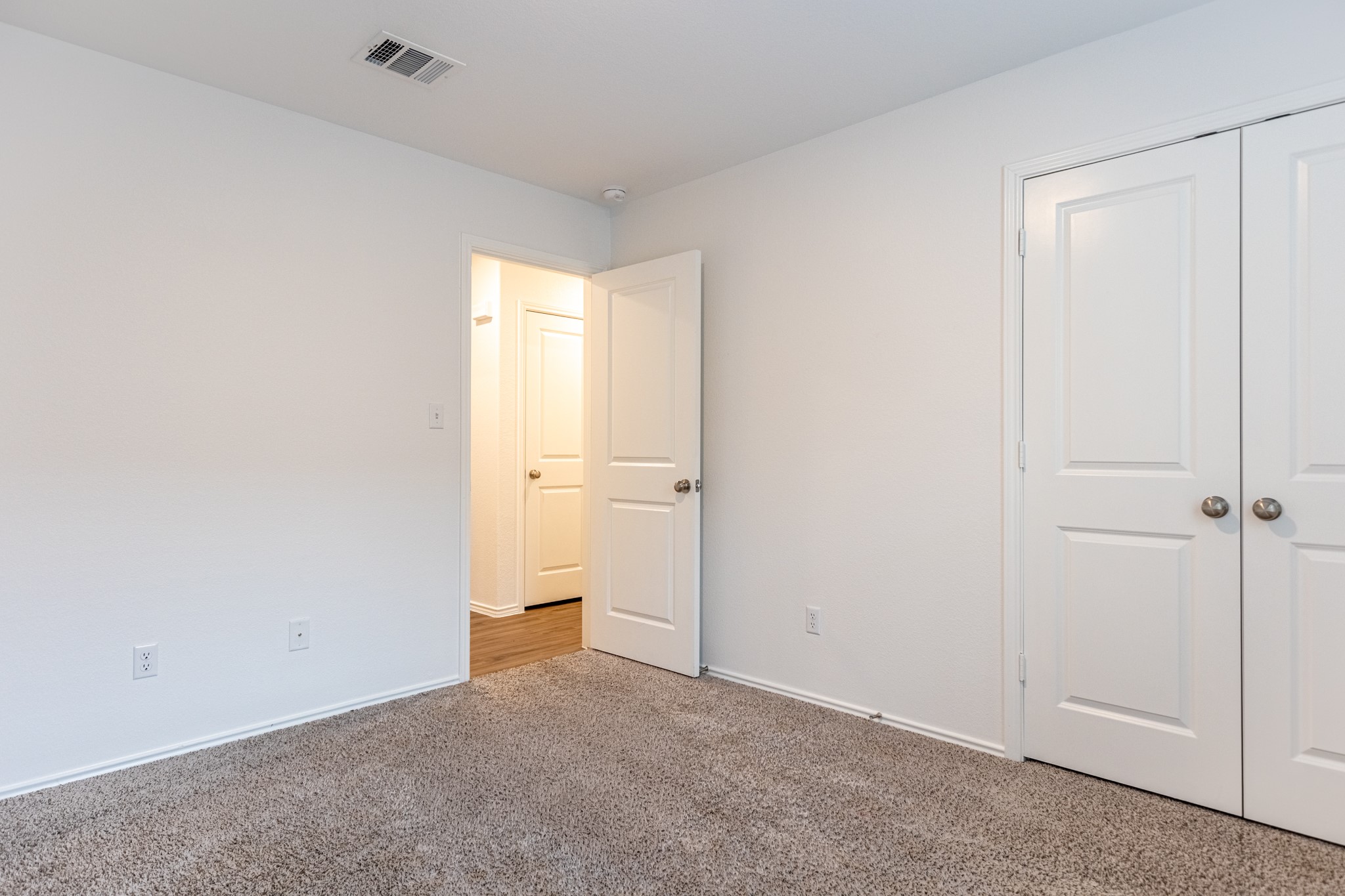 175 Silver Springs Bend Kyle, TX 78640 - Photo 18 of 33 Unfurnished bedroom featuring carpet floors and a closet