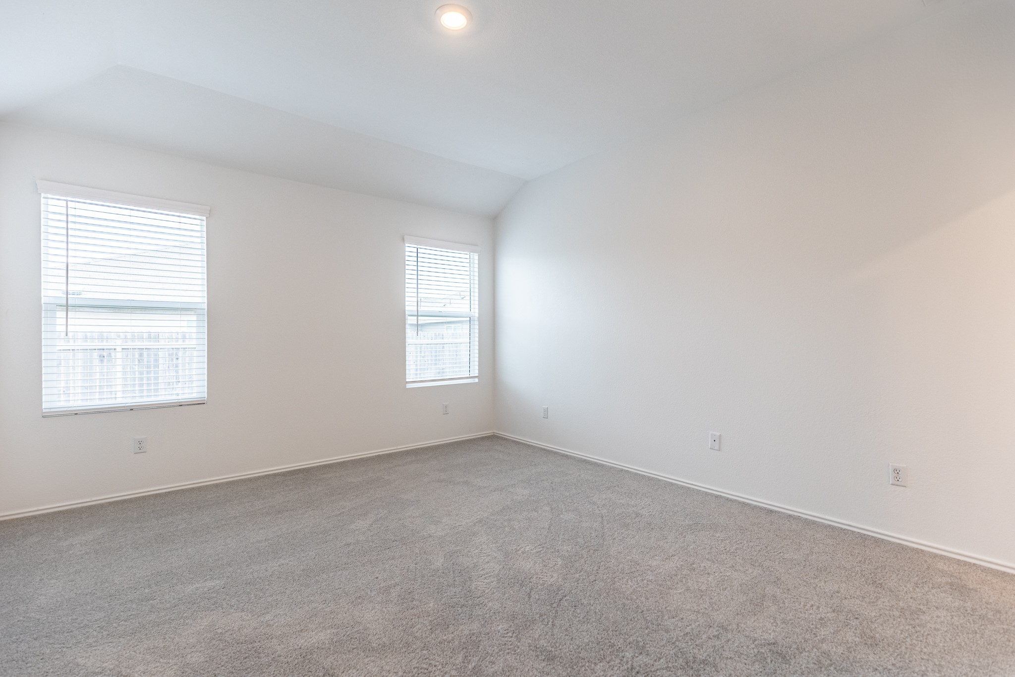 175 Silver Springs Bend Kyle, TX 78640 - Photo 22 of 33 Spare room featuring vaulted ceiling and carpet