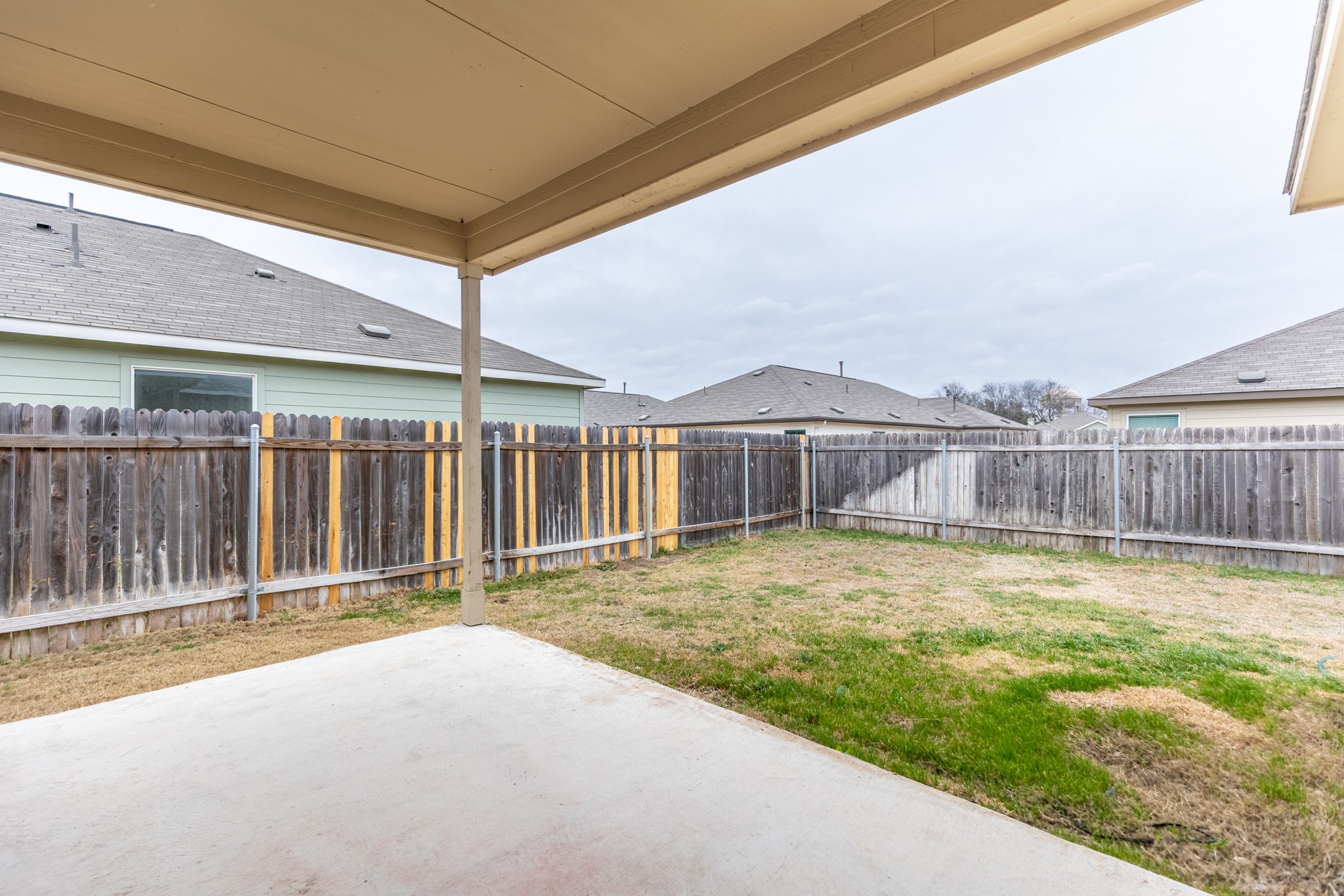 175 Silver Springs Bend Kyle, TX 78640 - Photo 31 of 33 Fenced backyard with a patio