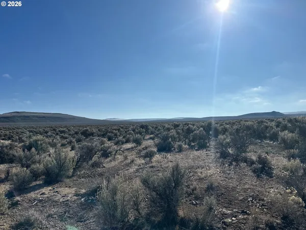 a view of ocean and mountains