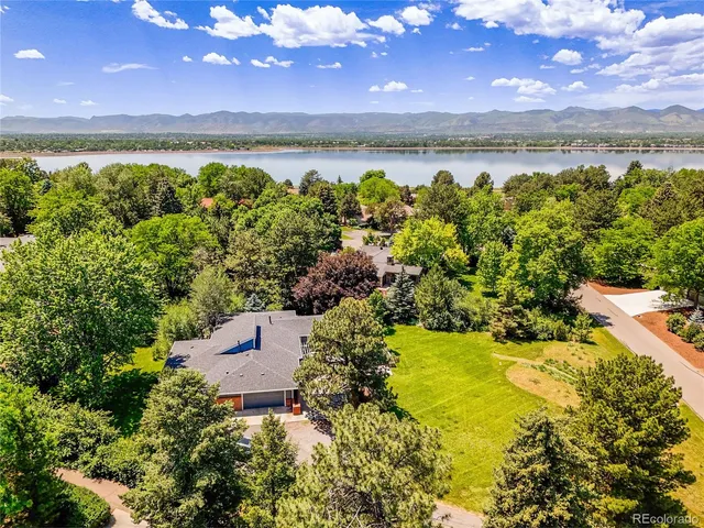 a view of a lake with houses in the back
