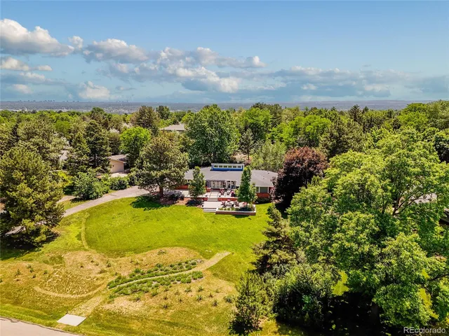 a view of a swimming pool with an outdoor seating and a yard
