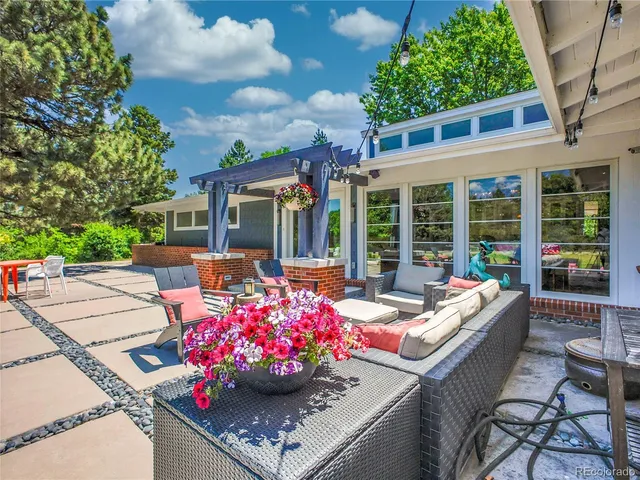 a outdoor space with patio the couches and a dining table with chairs