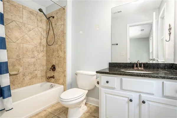 a bathroom with a sink a toilet and a bathtub
