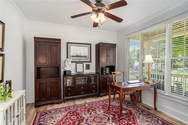 a living room with furniture lamp and window