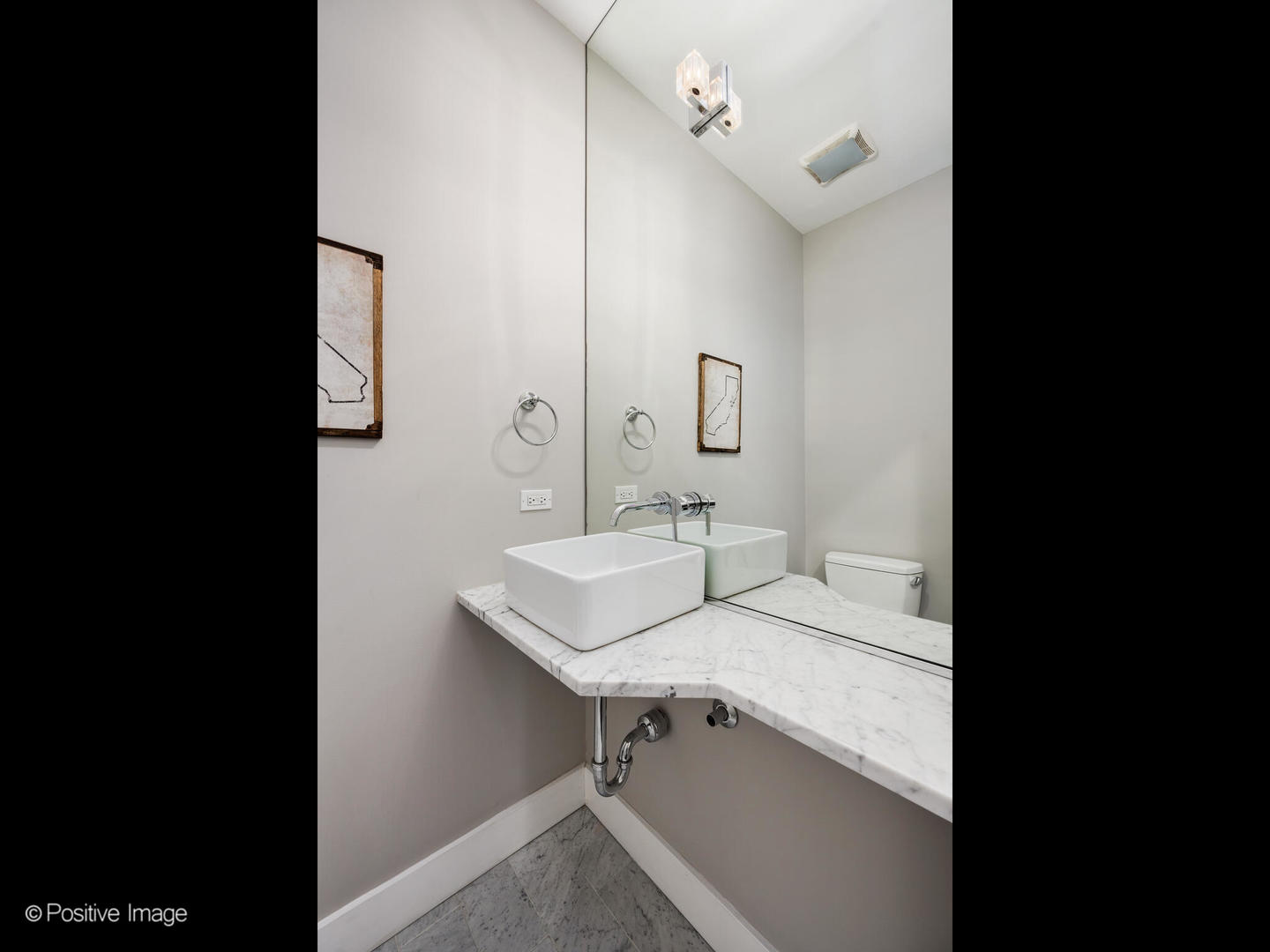 23 North Aberdeen Street, Unit 4S Chicago, IL 60607 - Photo 14 of 24 a view of a bathroom with a sink and mirror