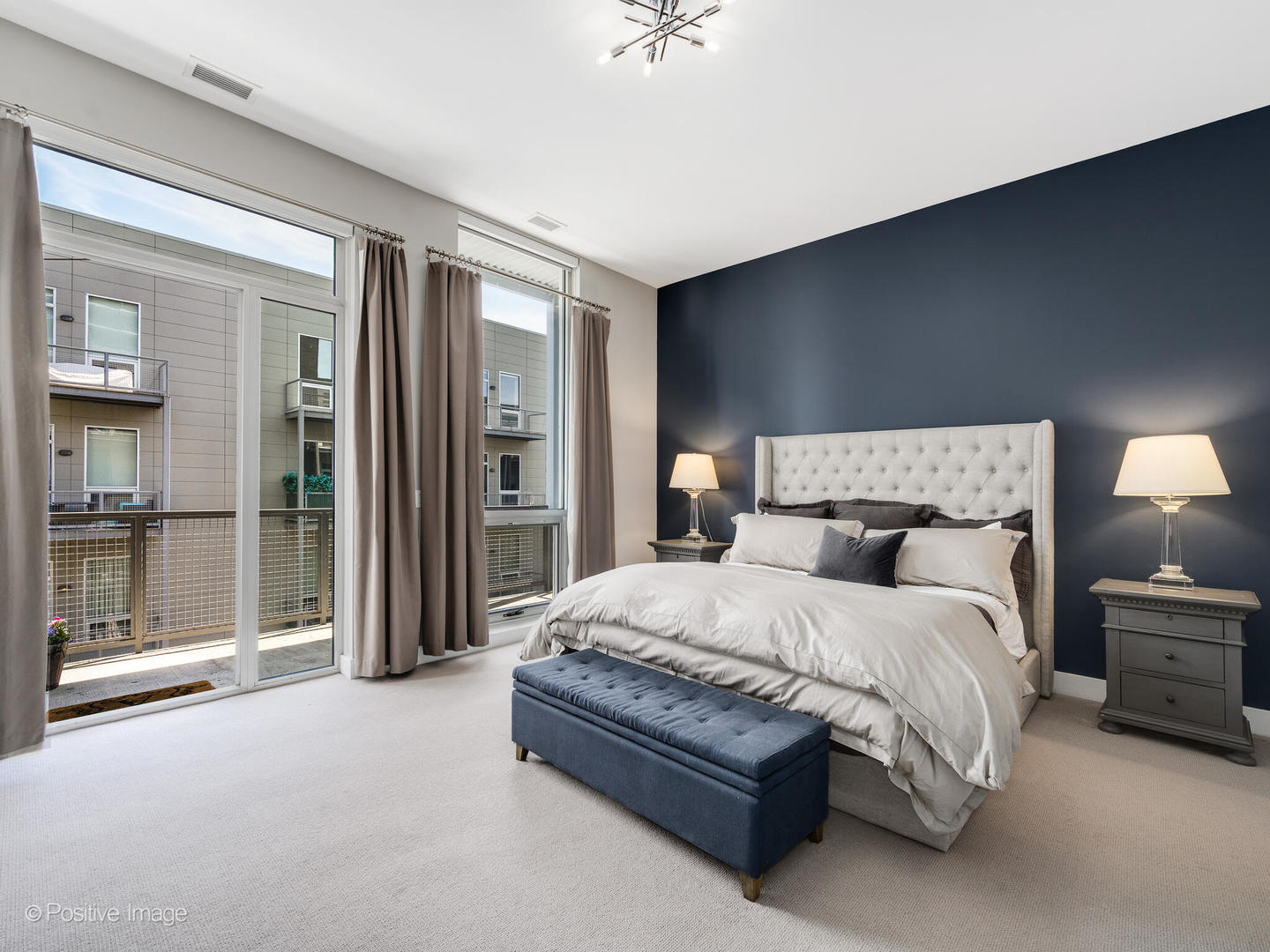 23 North Aberdeen Street, Unit 4S Chicago, IL 60607 - Photo 16 of 24 a spacious bedroom with a bed and a cabinets