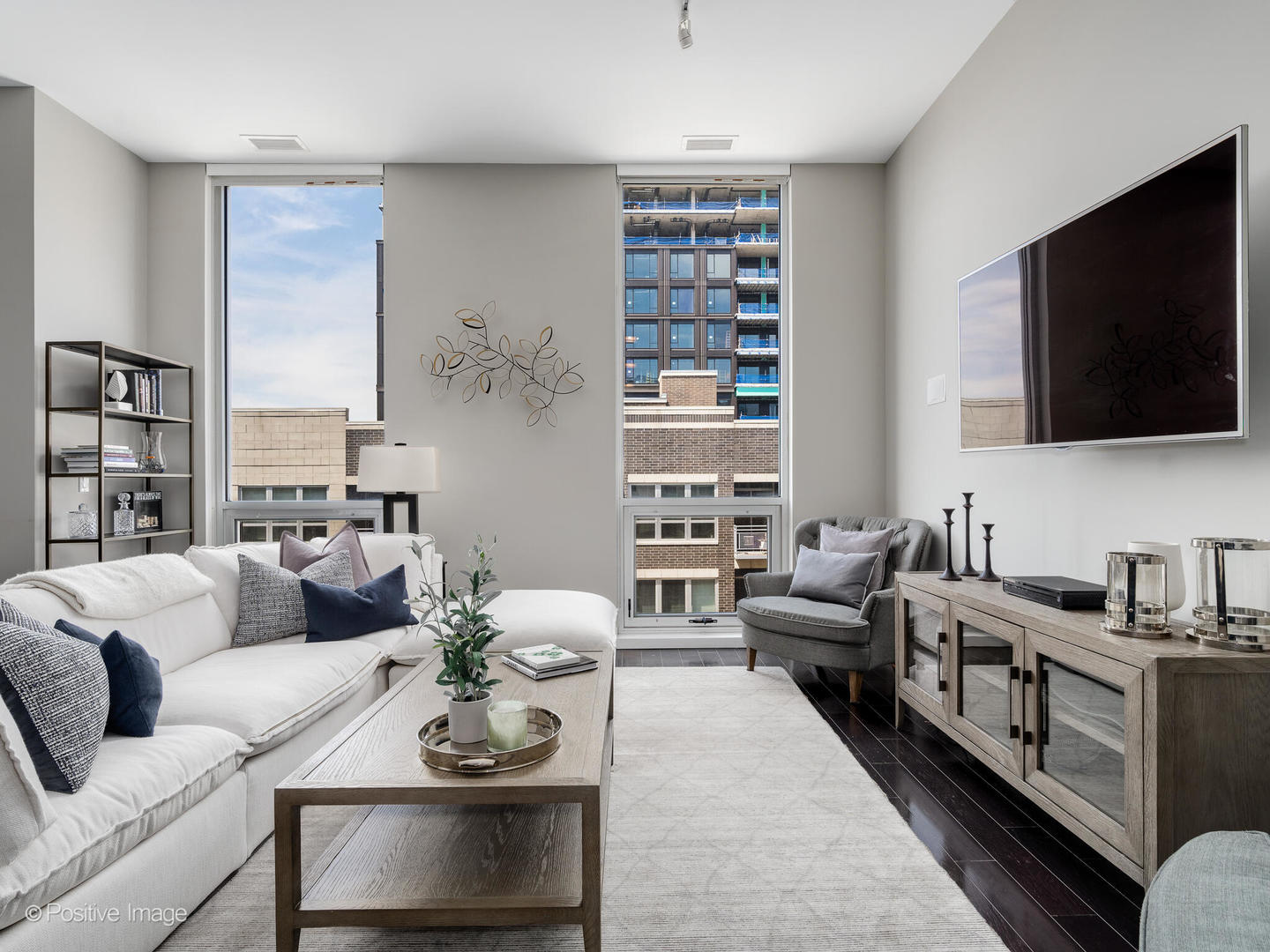 23 North Aberdeen Street, Unit 4S Chicago, IL 60607 - Photo 5 of 24 a living room with furniture a flat screen tv and a fireplace