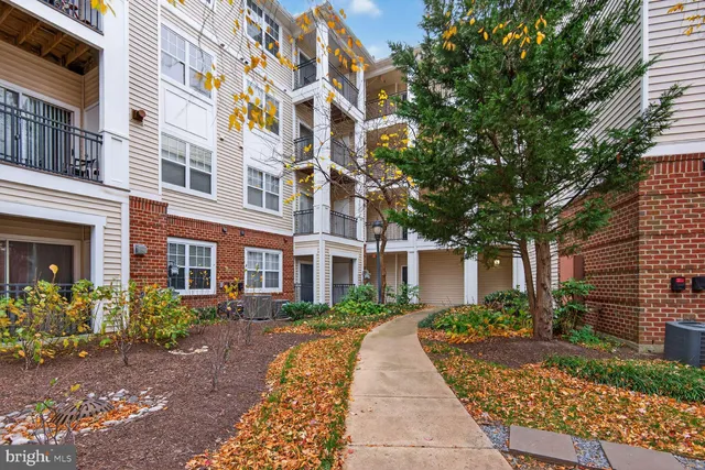a view of a building next to a yard
