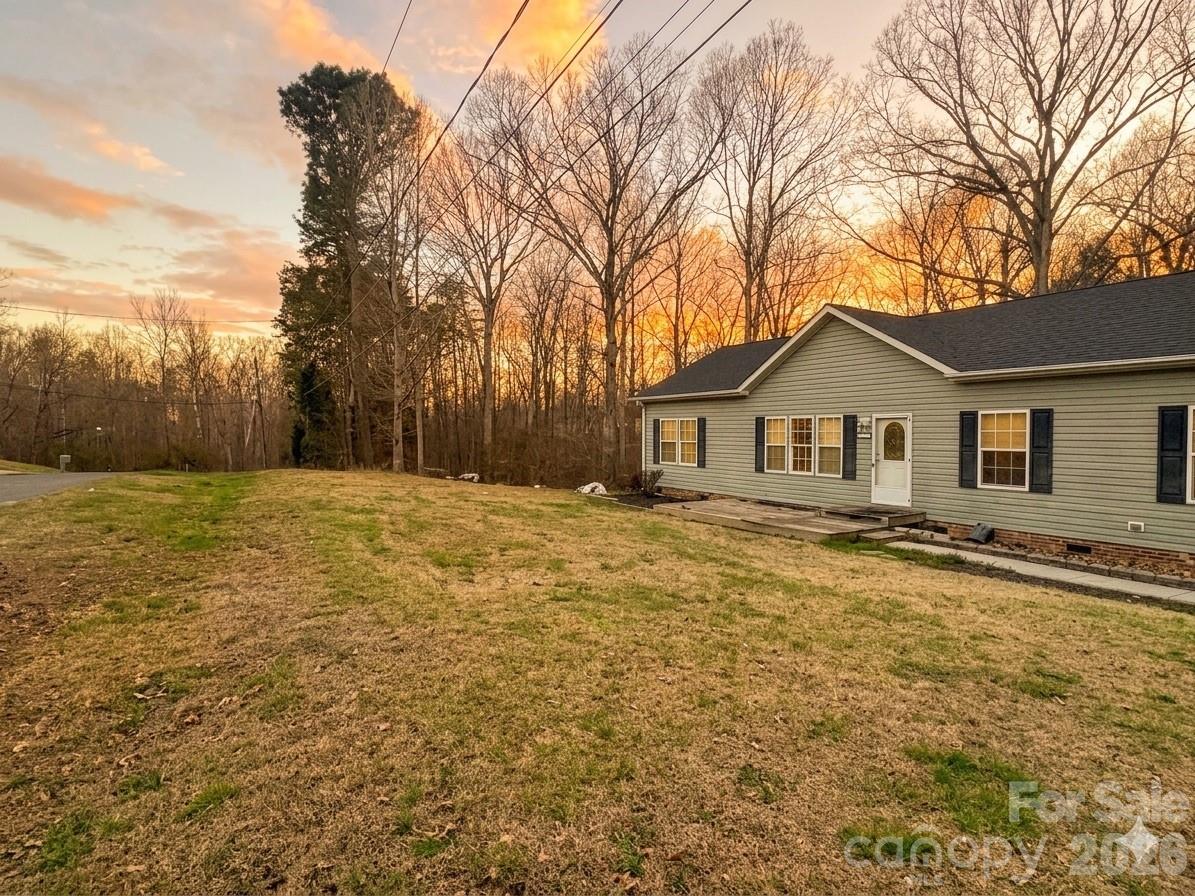 3233 Alamo Drive Trinity, NC 27370 - Photo 2 of 15 a front view of a house with a yard