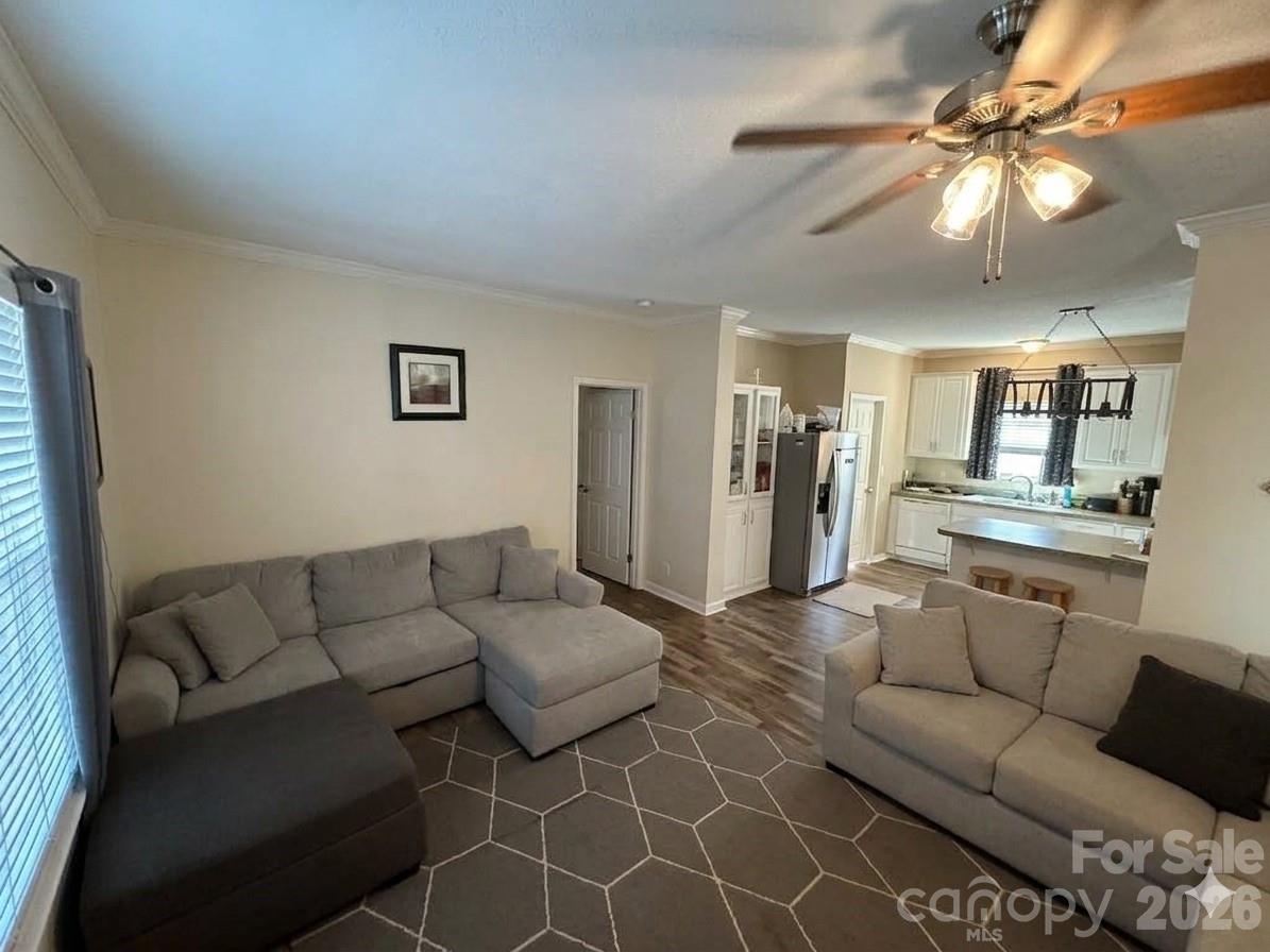 3233 Alamo Drive Trinity, NC 27370 - Photo 5 of 15 a living room with furniture and a chandelier