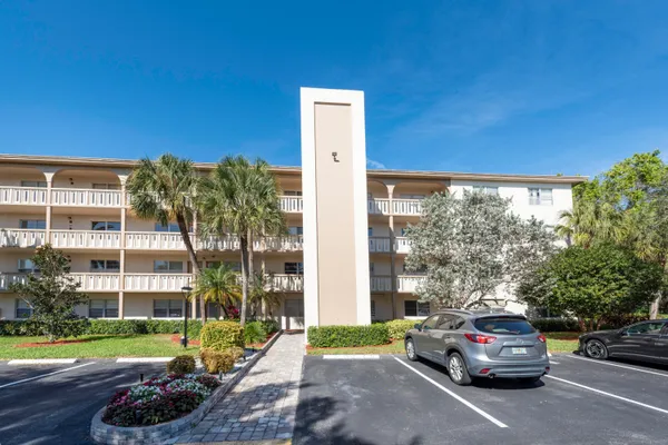a view of a car parked in front of a building