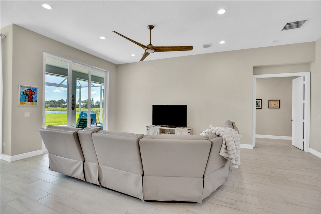 105 Night Hawk Way Sebastian, FL 32958 - Photo 12 of 36 a living room with furniture and a flat screen tv