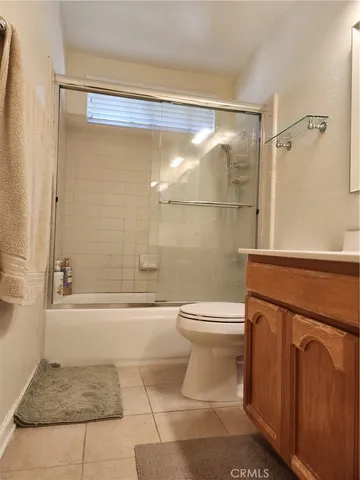 a bathroom with a shower a toilet and a shower