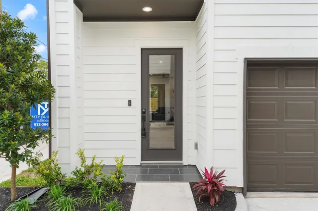 a potted plant on the side of a brick building